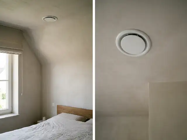 Toevoerventiel in het plafond van een slaapkamer